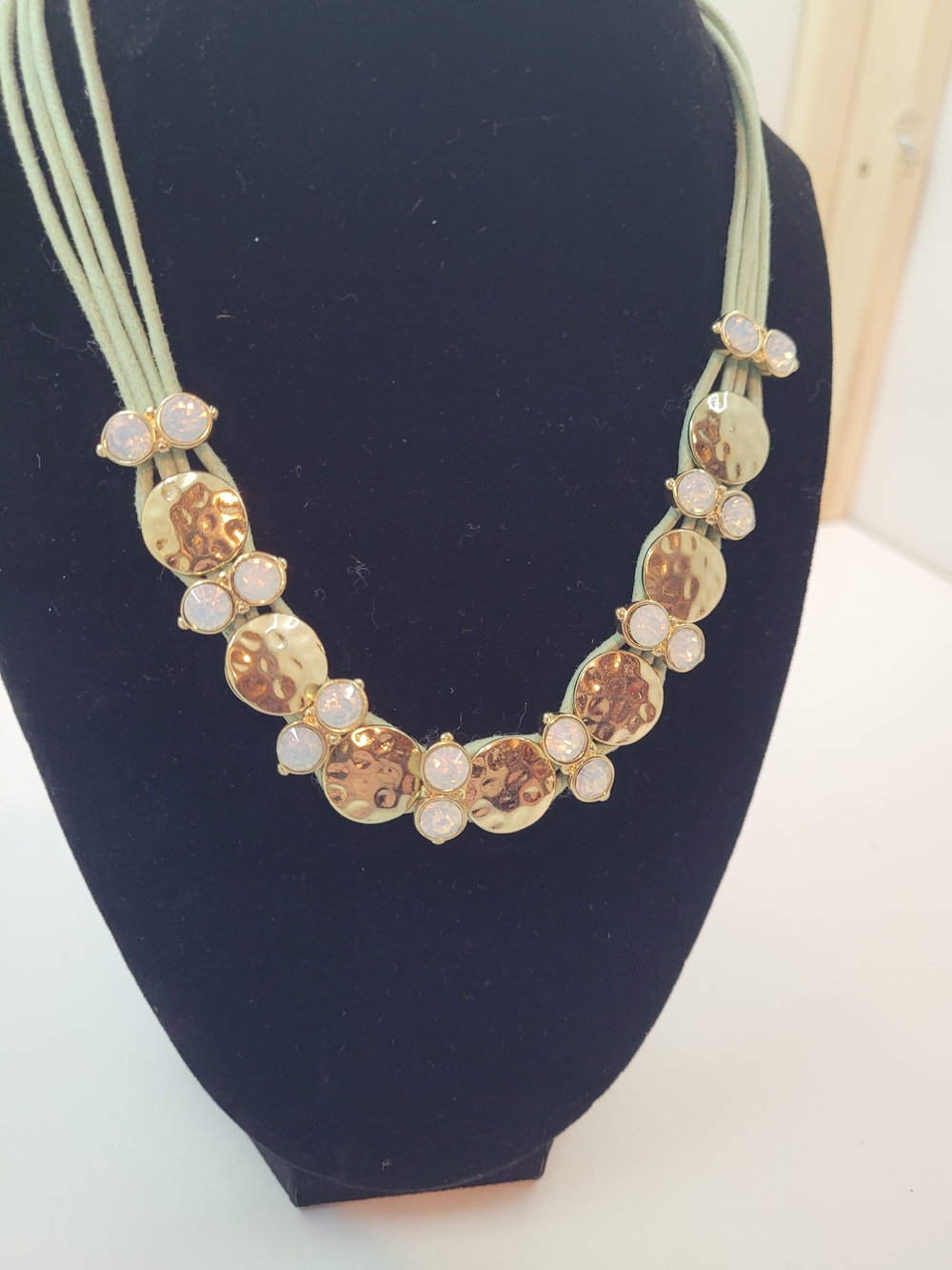 St. Thomas Gold Hammered Disc Necklace with Opalescent Accents on Green Cord